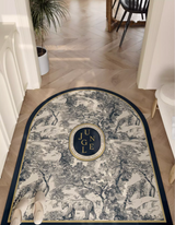 Elevate your entryway with stylish French-inspired, exotic jungle-animal themed Blue Jungle Door Mat. Waterproof, durable & non-slip "Toile de Jouy" print vinyl rug.